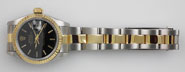 Ladies Rolex DateJust 18K/SS With Black Dial Oyster Bracelet