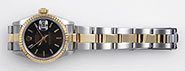 Ladies Rolex Oyster Perpetual DateJust 69173 18K/SS Black Dial