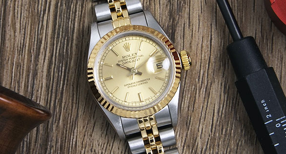 Ladies Rolex Oyster Perpetual 18K/SS Champagne Dial 69173